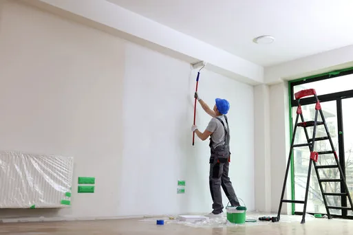 Painter rolling a bright production office wall in Burbank's Media District